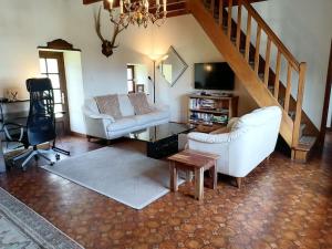 a living room with two couches and a tv at Brittany France 2 Beds Free Wi-Fi - Parking & Garden in La Haye