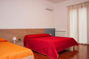 Postel nebo postele na pokoji v ubytování Casa Vacanze Caruso + 18 fotografií