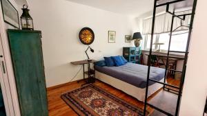 Ένα ή περισσότερα κρεβάτια σε δωμάτιο στο Cosy 1-Bed studio apartment in Roma
