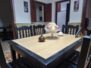 a table with a glass bowl on top of it at Traditional apartment in the center of Agadir in Agadir