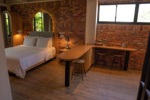 Postel nebo postele na pokoji v ubytování Nomada Hotel Origen