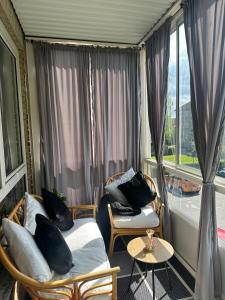 a room with two beds and a window at Cozy Bedroom in Søborg