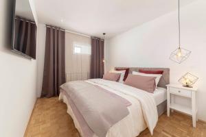 Postel nebo postele na pokoji v ubytování DSE Apartment