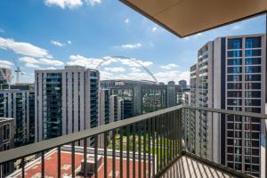 a balcony with a view of the london eye at State-of-the-Art 1 bedroom Apartments near Wembley Park in London
