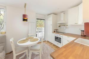 Kuchyň nebo kuchyňský kout v ubytování DSE Apartment
