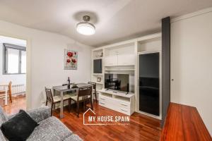 a living room with a table and a dining room at MyHouseSpain - Tranquilo piso cerca de Sol in Madrid