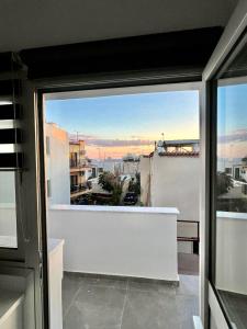 a balcony with a view of a city at Napa Entry Apts in Ayia Napa