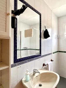 a bathroom with a sink and a mirror at Casa Rural Pernales II in Ruidera +39 photos