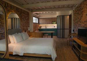 Postel nebo postele na pokoji v ubytování Nomada Hotel Origen