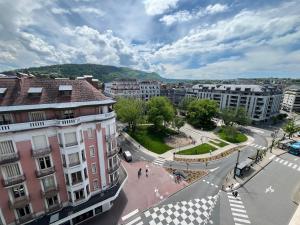 an aerial view of a city with buildings and a street at Studio 138 in Annecy