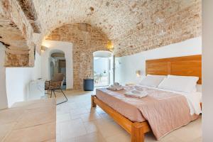 Postel nebo postele na pokoji v ubytování Naturelais Masseria Pittore Monopoli