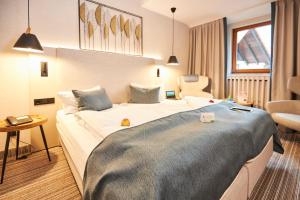 Postel nebo postele na pokoji v ubytování Flair Hotel Werbetal