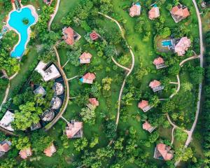 an overhead view of a park with houses and trees at The Westin Sohna Resort & Spa in Gurgaon