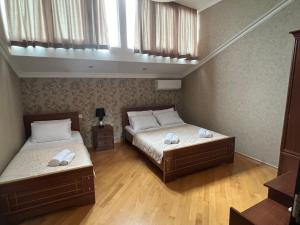 Postel nebo postele na pokoji v ubytování Guesthouse Emilya