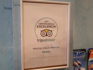 a framed picture of the olympic sign for the olympics at Hostal Villa Maruja in El Arenal