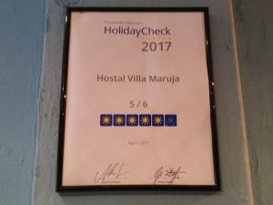 a sign for the hollywoodcheck hospitalilla mandapa at Hostal Villa Maruja in El Arenal