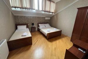 Postel nebo postele na pokoji v ubytování Guesthouse Emilya