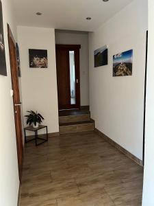 a hallway with a stairway with a potted plant at Apartmány Bowling Frýdlant in Frýdlant
