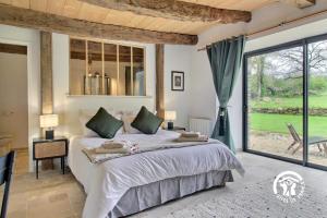 Ένα ή περισσότερα κρεβάτια σε δωμάτιο στο Le gite d'Arthur +37 φωτογραφίες