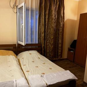 Postel nebo postele na pokoji v ubytování Hotel Premium