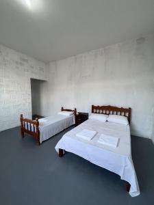 Ένα ή περισσότερα κρεβάτια σε δωμάτιο στο Apartamentos Itamaraty
