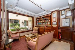 a home office with a desk and chairs and a window at Taksim Pera Rose Hotel & Spa - Istiklal Street in Istanbul
