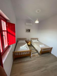 Postel nebo postele na pokoji v ubytování Sugar Stone House 2