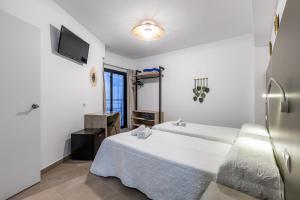 Cama o camas de una habitación en Hostal Alicante