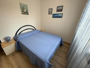 Ένα ή περισσότερα κρεβάτια σε δωμάτιο στο App4rent Residence Gaia 12 - in centro, con piscina, posto auto...