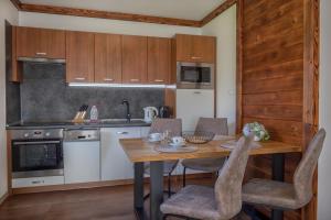A kitchen or kitchenette at Apartmany Krasvill