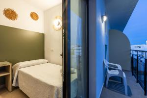 Cama o camas de una habitación en Hostal Alicante