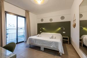 Cama o camas de una habitación en Hostal Alicante