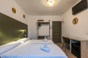 Cama o camas de una habitación en Hostal Alicante