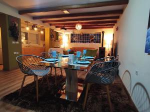 a dining room with a table and four chairs at Katia 's Country House in Sikión