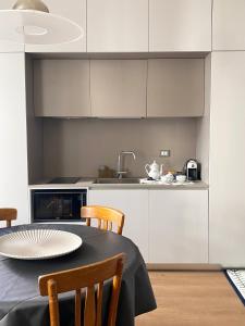 a kitchen with a table with chairs and a sink at La Torre in Florence