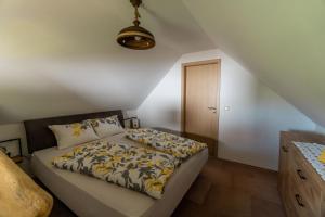 Postel nebo postele na pokoji v ubytování WeinSpitz - Wellness House