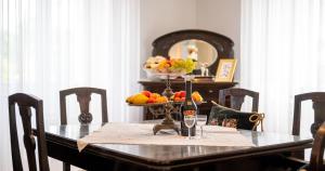 a table with a bowl of fruit and a bottle of wine at Villa Celio-Cega for 4+2, Trogir center in Trogir +22 photos