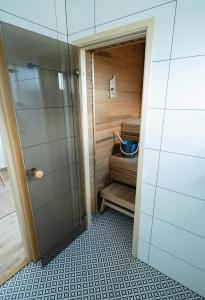 a bathroom with a shower and a sink at Private House with 4 Bedrooms and SAUNA near TARTU 