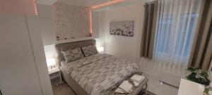 Voodi või voodid majutusasutuse GOLD APARTMANI toas