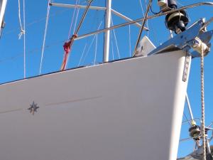 a large white board on the bow of a boat at Bed on Boat 36031 corfu in Ágios Rókkos