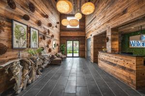 a lobby of a restaurant with wooden walls at The Watershed - Formerly Hotel Zero Degrees in Norwalk