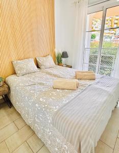 En eller flere senge i et værelse på Orlando Luxury Costa Adeje