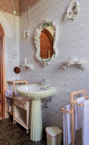 a bathroom with a sink and a mirror on the wall at B & B Torre Saracena in Mattinata