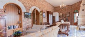 a living room with a couch and a table at B & B Torre Saracena in Mattinata
