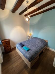 Ένα ή περισσότερα κρεβάτια σε δωμάτιο στο Maison de ville avec terrasse