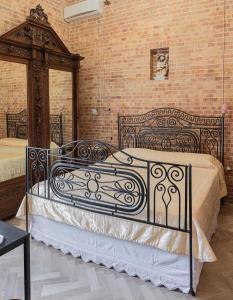 Postel nebo postele na pokoji v ubytování B & B Torre Saracena
