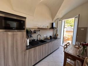 a kitchen with a sink and a counter at La Dolce Vista in Dolceacqua