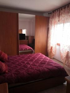 Ліжко або ліжка в номері Appartamento mare Torvaianica via Pola
