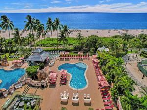an aerial view of a resort with a pool and the beach at Beach Resort condo 921 in Miami Beach