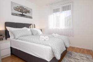Postel nebo postele na pokoji v ubytování Studio Apartman Apollonia
